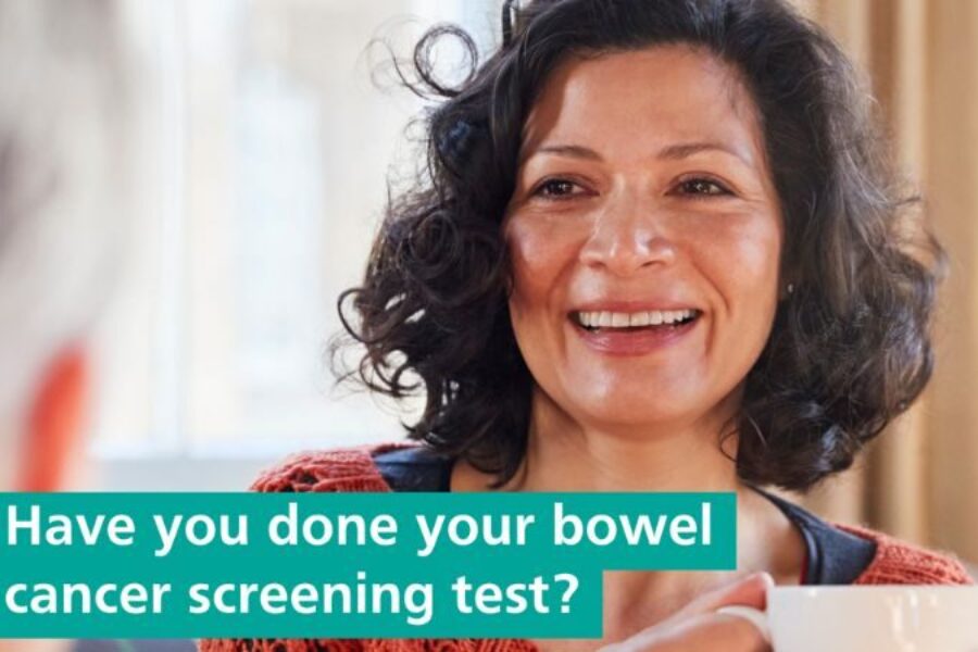 A smiling woman holding a cup. Words read ' have you done your bowel cancer screening test?'