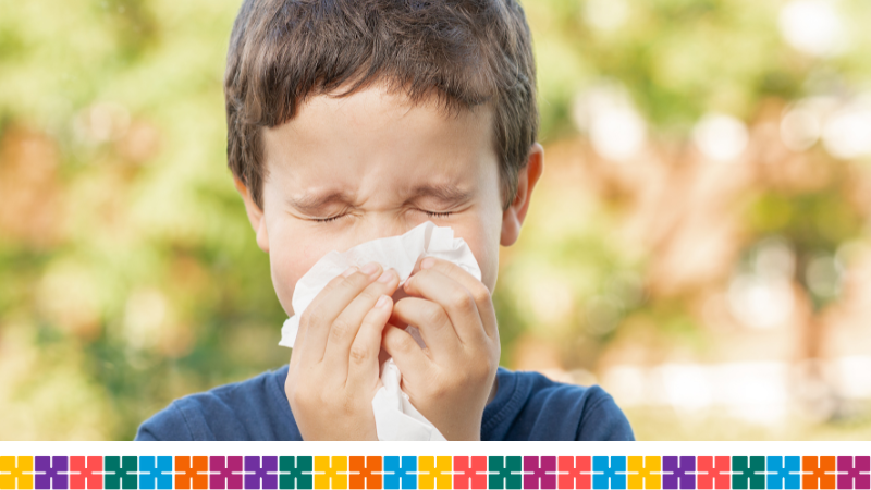 Boy blowing his nose