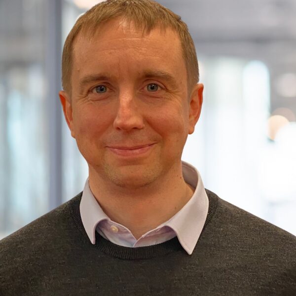 Head an shoulders picture of a an smiling at the camera