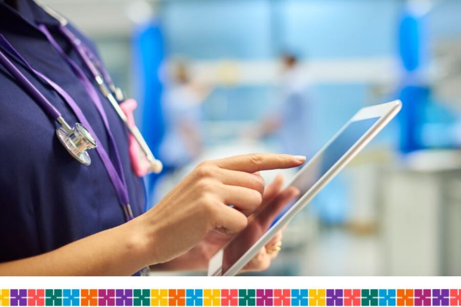 Clinician in hospital using tablet